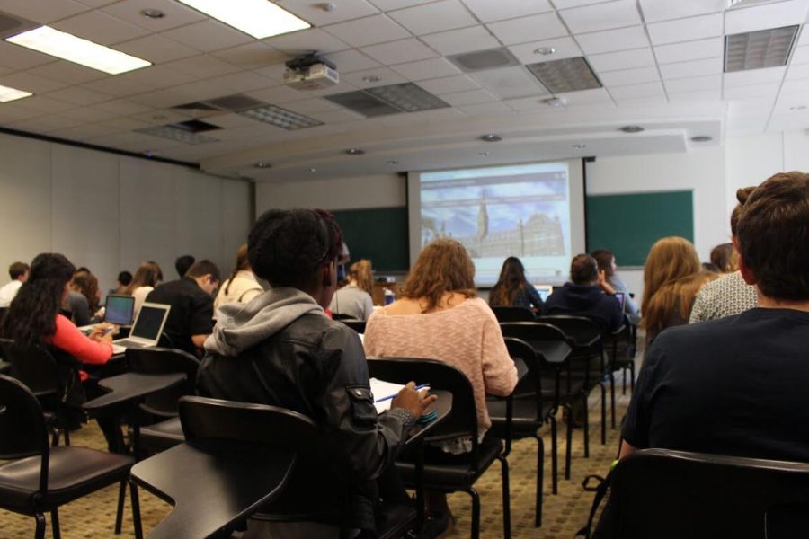 Students at Georgetown University listen to their professor during an introductory psychology course. Current Wilson students participating in HiScip and previous students now in college find actual college courses much harder than the AP classes they took in high school. 