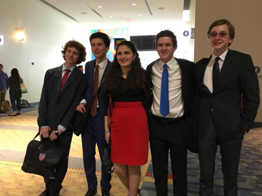 DEBATIN' WITH FINESSE- The Wilson debate team competed against hundreds of other debaters and speakers at the Grand National tournament for the Catholic Forensic League in the Washington Convention Center.  Sophomore Elie Salem (far left) and freshman Tristan May (far right) advanced to the first elimination round.