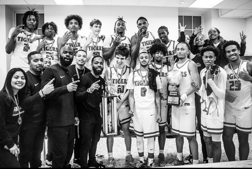 CITY CHAMPS: The Tigers post game in the locker room after beating Cardozo High School Saturday night. 