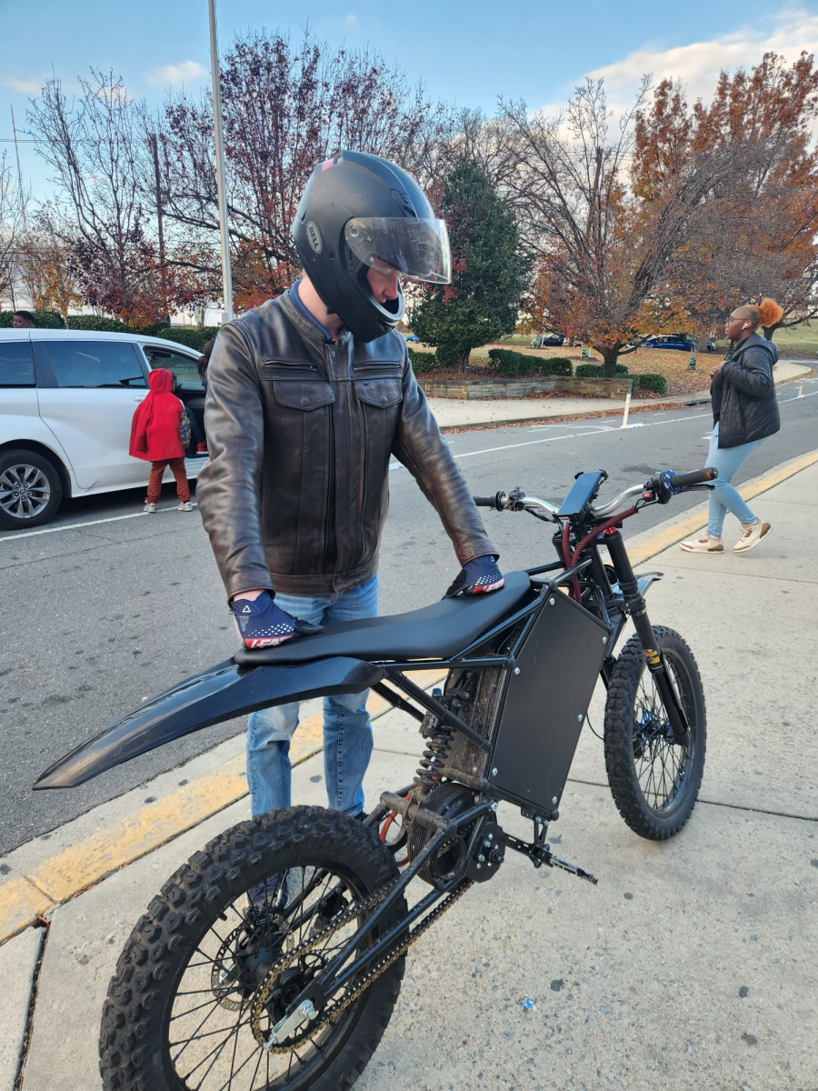 E-BIKE LEGEND: Jake from “Jake’s E-Bike Repairs” is seen here posing with his custom-built bike in front of Jackson-Reed