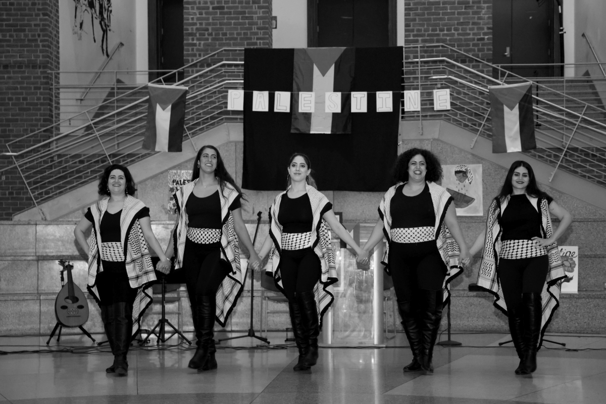 BREAKING NEWS - A group dances at Palestinian culture night in the atrium hosted by the Arab Student Union. The event took place the night after the ASU filed a lawsuit against Principal Brown and the city.