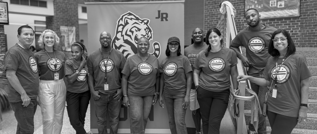 UNITED FRONT - Jackson-Reed teachers pose in their WTU shirts.