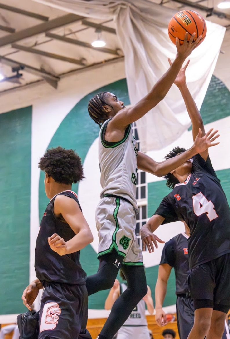 SMOOTH FINISH: Senior guard Pete Newman attempts a layup against Dunbar on Dec. 18. 