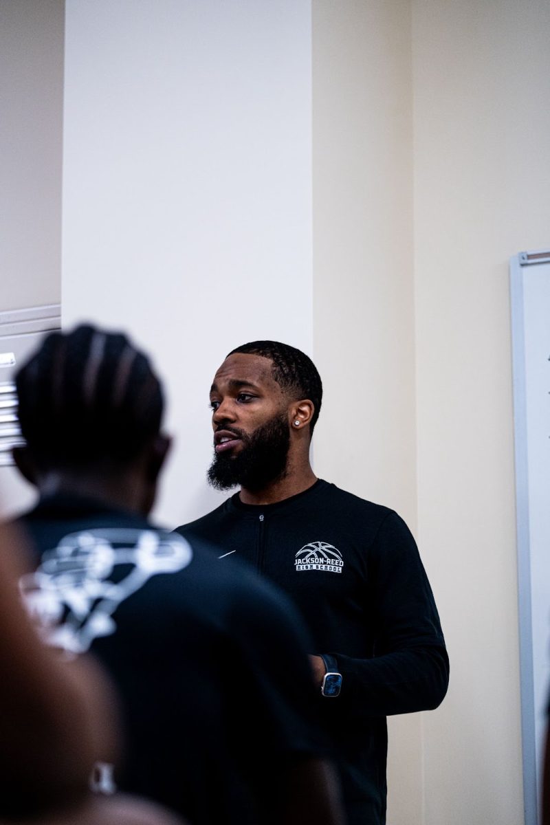 TEAM LEADER: Johnson speaks to his team ahead of a DCIAA championship win over Cardozo High School in the 2023-24 winter season. 